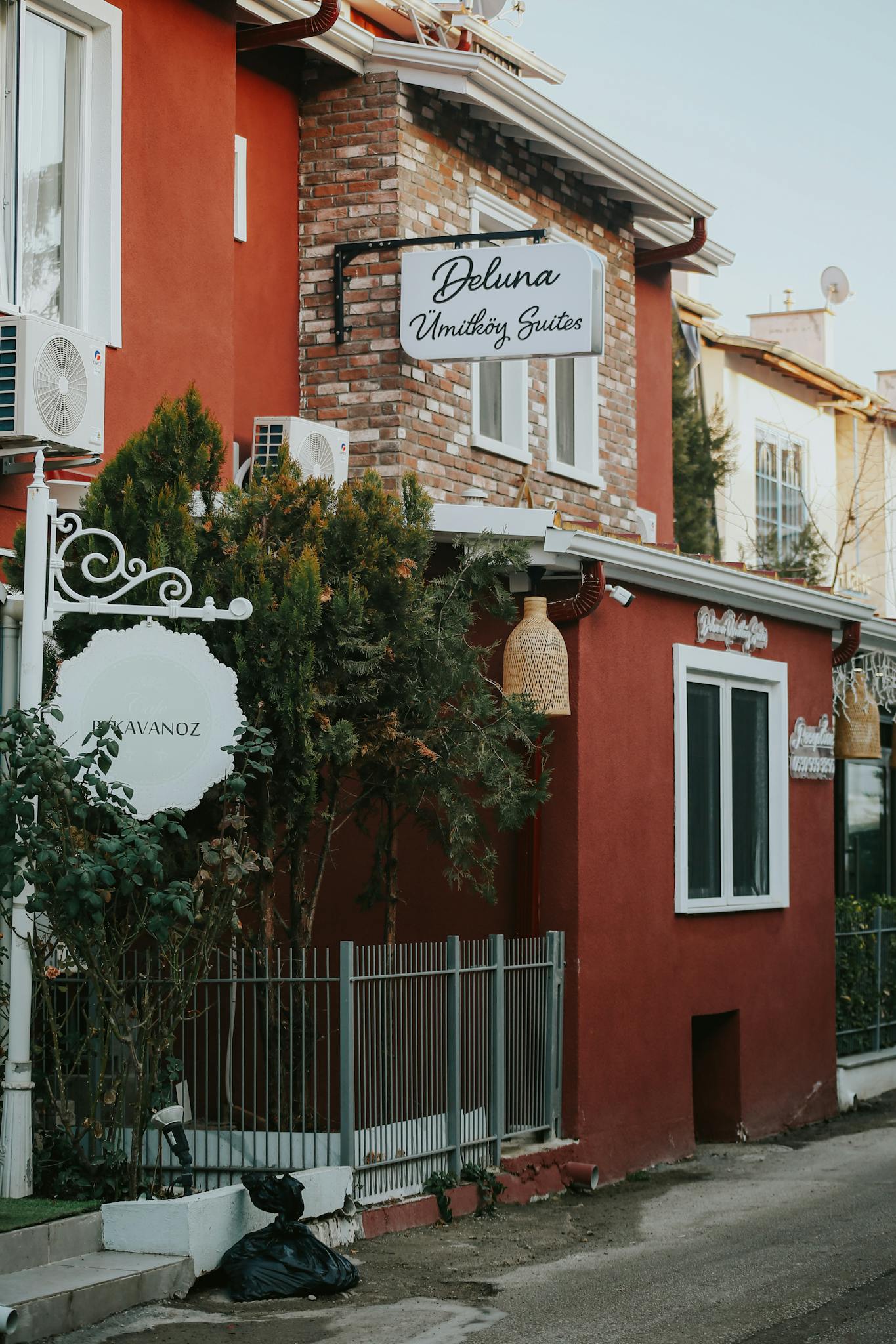 Charming exterior view of a rustic boutique hotel emphasizing unique architectural details.